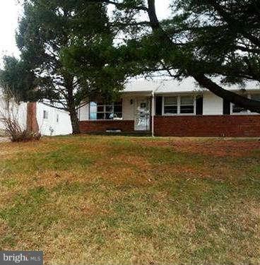 4219 Mispillion Road Baltimore, MD 21236 - Photo 1 of 1 a front view of a house with a garden