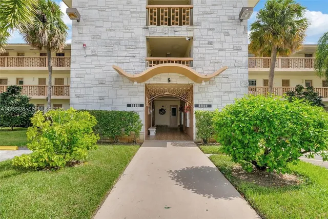 a view of a house with a small garden
