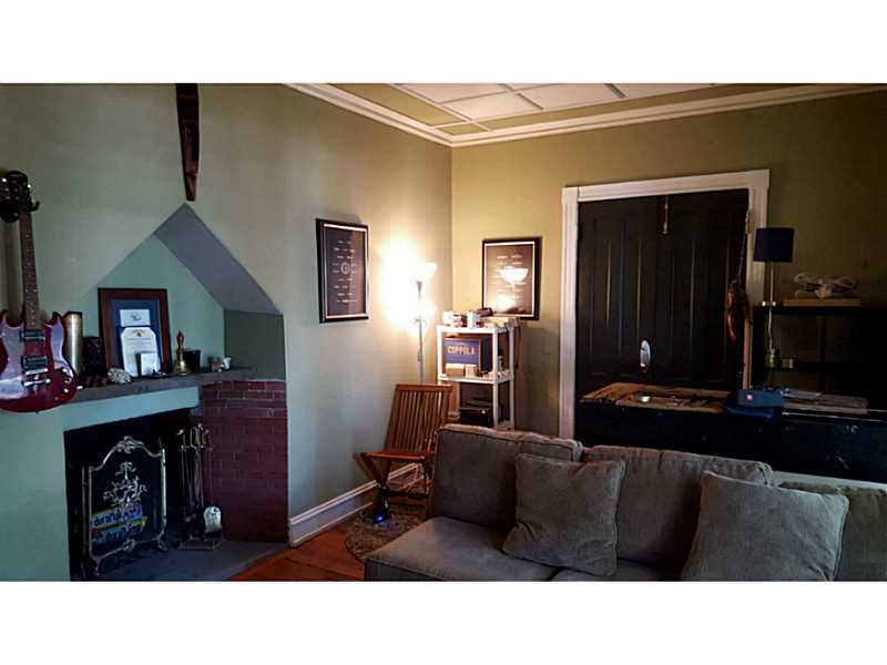 48 Everett Street, Unit B Newport, RI 02840 - Photo 6 of 17 Living Room. brick fireplace