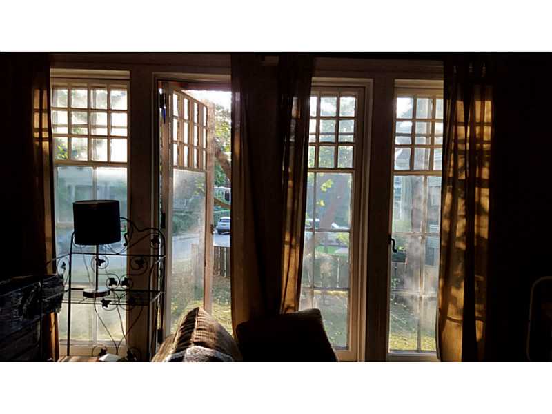 48 Everett Street, Unit B Newport, RI 02840 - Photo 8 of 17 Living Room. turn of the century style authentic glass plate windows.