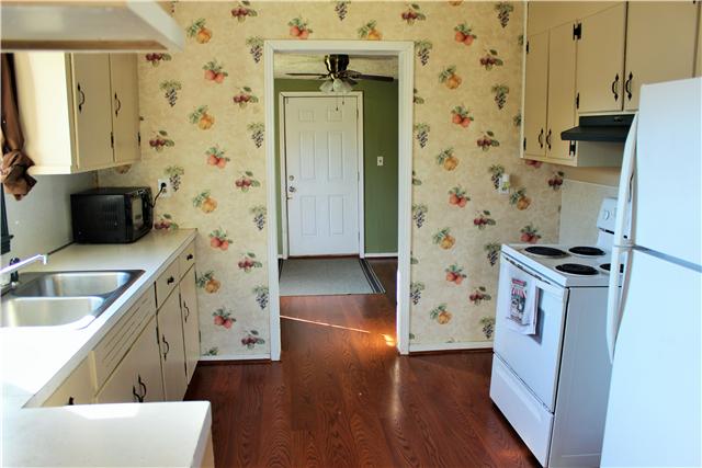 420 Linwood Road Watertown, TN 37184 - Photo 6 of 15 Lots of cabinets here! Kitchen has recently updated hardwood flooring & ALL appliances remain; including refrigerator.
