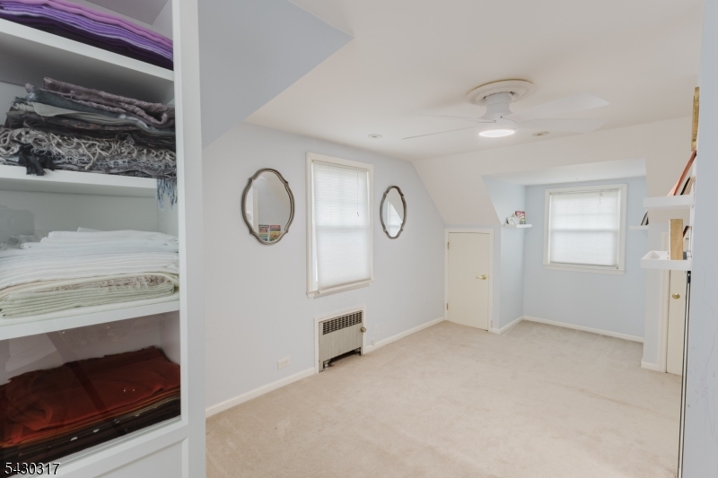 382 Martin Road Union, NJ 07083 - Photo 12 of 30 a view of an empty room with a fireplace and a window