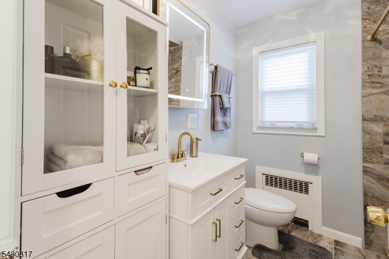 382 Martin Road Union, NJ 07083 - Photo 17 of 30 a bathroom with a sink toilet and shower