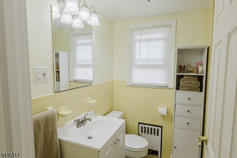 382 Martin Road Union, NJ 07083 - Photo 19 of 30 a bathroom with a sink a toilet and mirror