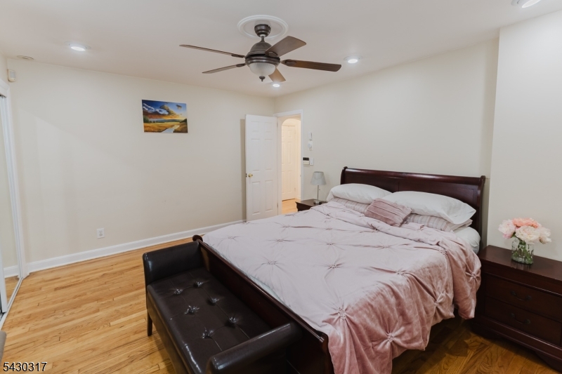 382 Martin Road Union, NJ 07083 - Photo 21 of 30 a bedroom with a bed and a ceiling fan