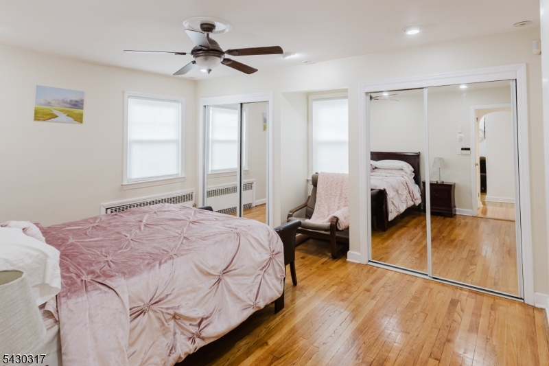 382 Martin Road Union, NJ 07083 - Photo 22 of 30 a bedroom with a bed and ceiling fan