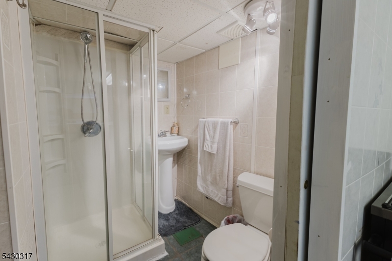 382 Martin Road Union, NJ 07083 - Photo 23 of 30 a bathroom with a toilet and a shower