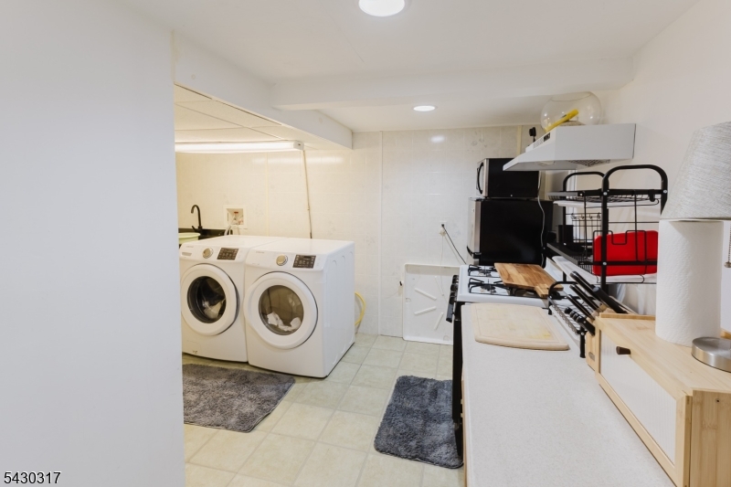 382 Martin Road Union, NJ 07083 - Photo 26 of 30 a view of a storage & utility room with washer and dryer
