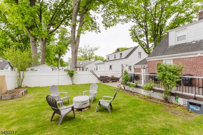 382 Martin Road Union, NJ 07083 - Photo 28 of 30 a backyard of a house with table and chairs
