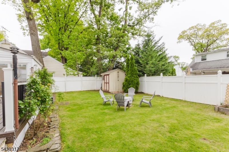 382 Martin Road Union, NJ 07083 - Photo 29 of 30 a backyard of a house with table and chairs