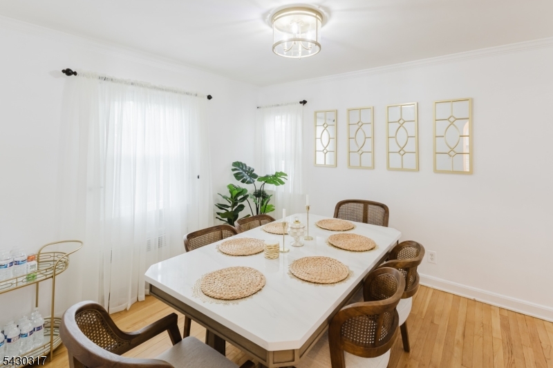 382 Martin Road Union, NJ 07083 - Photo 5 of 30 a view of a dining room that has a table and chairs
