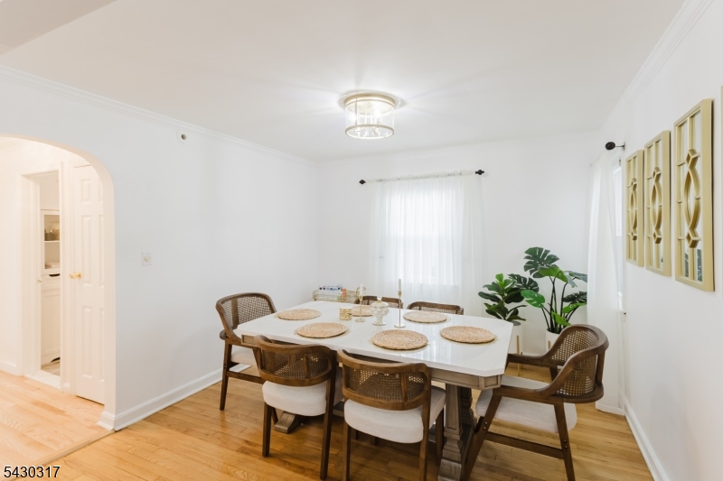382 Martin Road Union, NJ 07083 - Photo 6 of 30 a view of a dining room with furniture and wooden floor