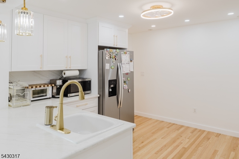 382 Martin Road Union, NJ 07083 - Photo 9 of 30 a kitchen with a refrigerator a sink and a stove