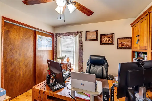 a work room with furniture and wooden floor