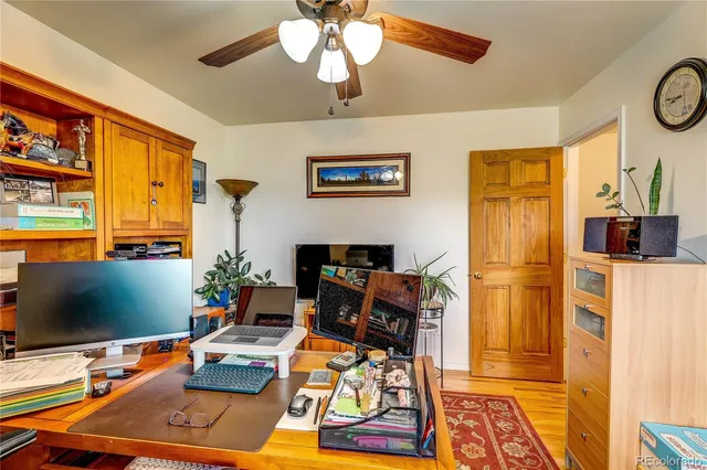 a room with furniture a rug and a flat screen tv