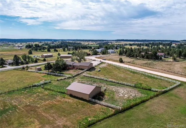 swimming pool view with a lake view in back