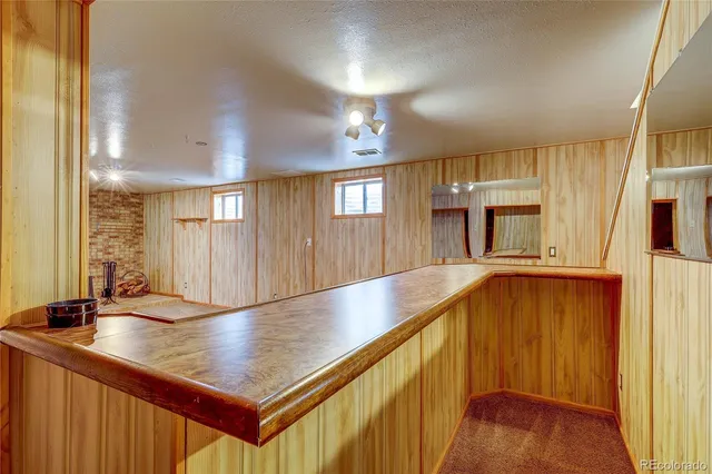 a view of kitchen with cabinets and wooden floor