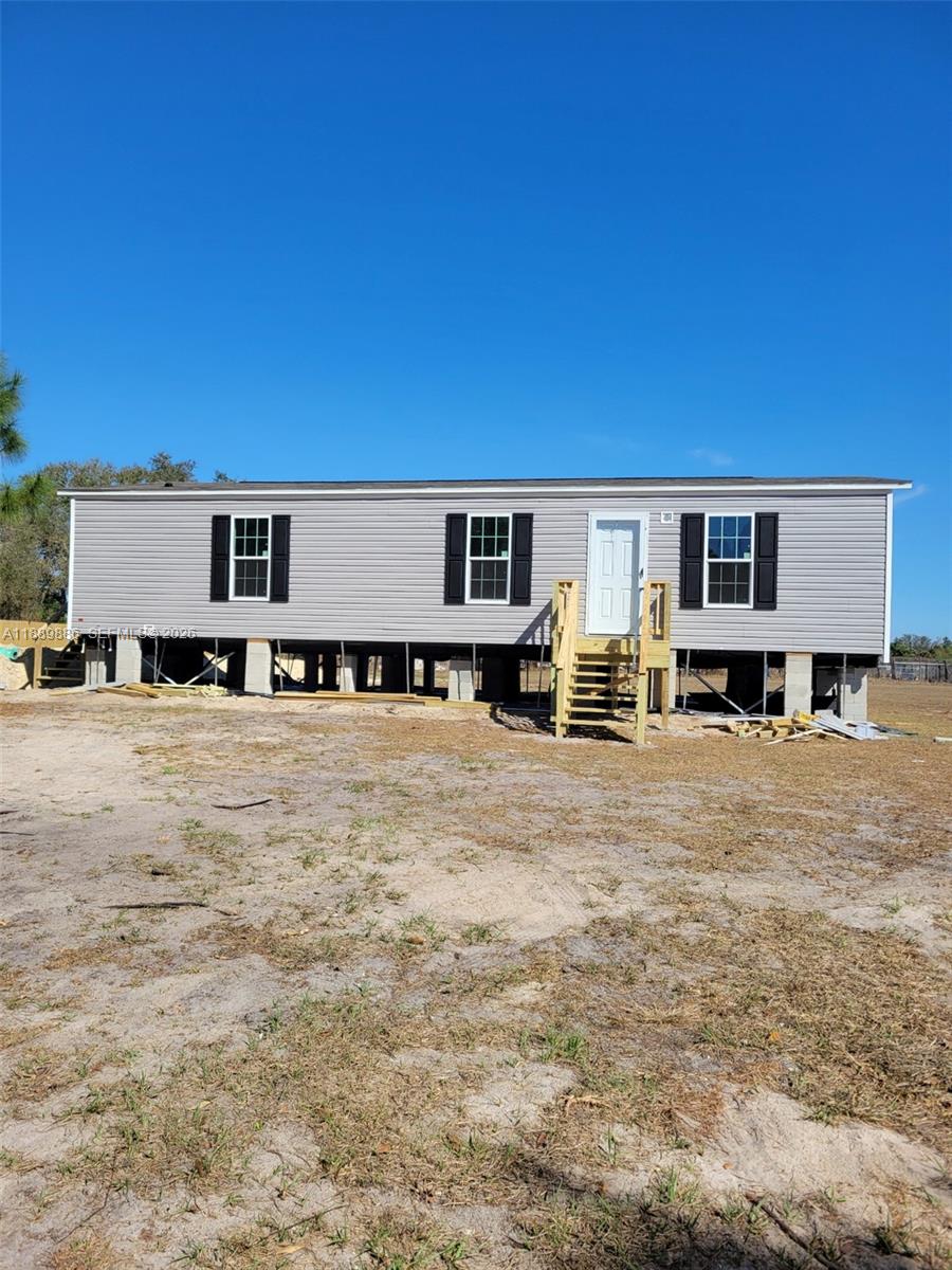 357 Horse Club Avenue Clewiston, FL 33440 - Photo 1 of 17 Front of Structure, newly constructed mobile home under progress.