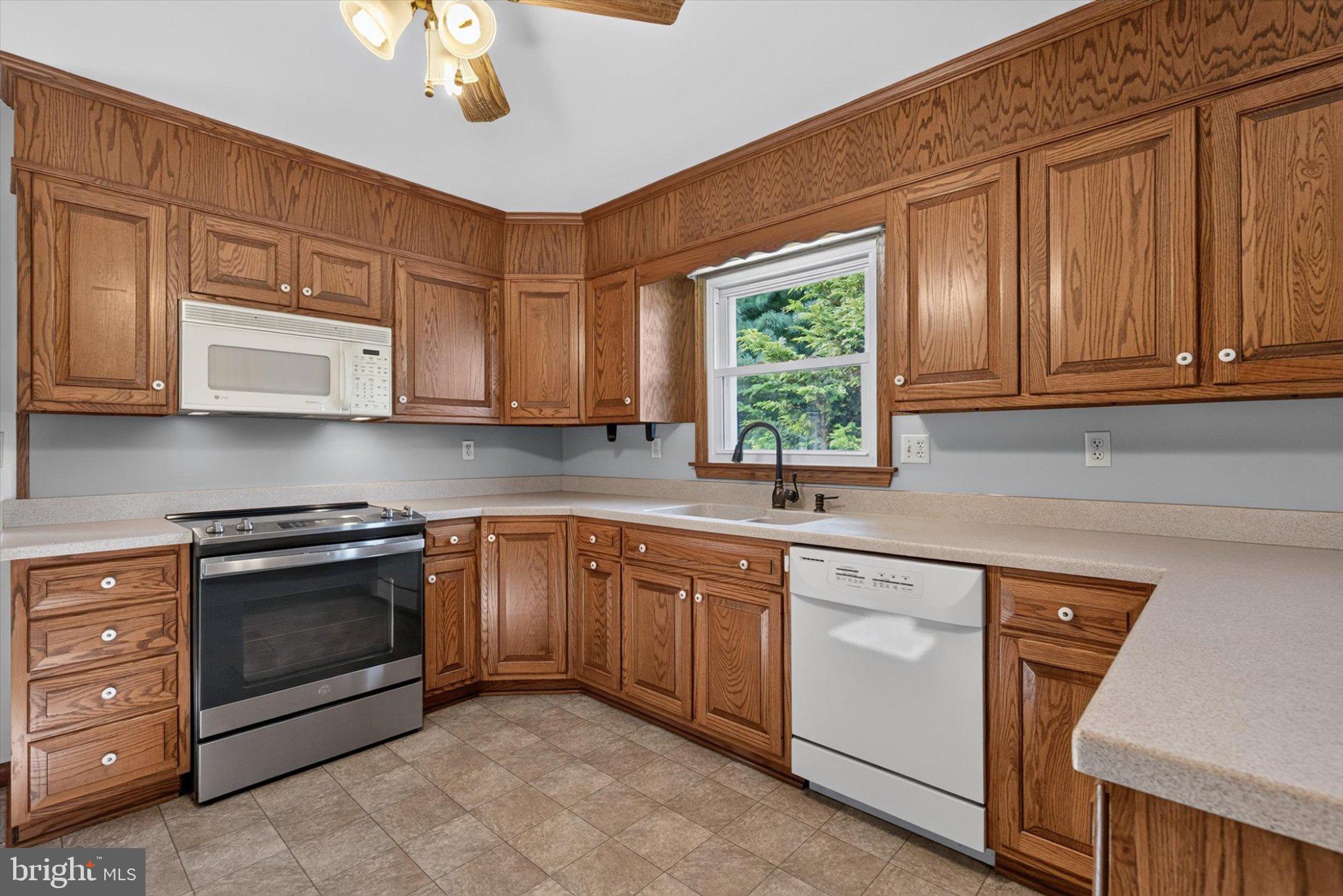 239 Lawn Road Palmyra, PA 17078 - Photo 10 of 64 Warm oak kitchen with modern appliances.