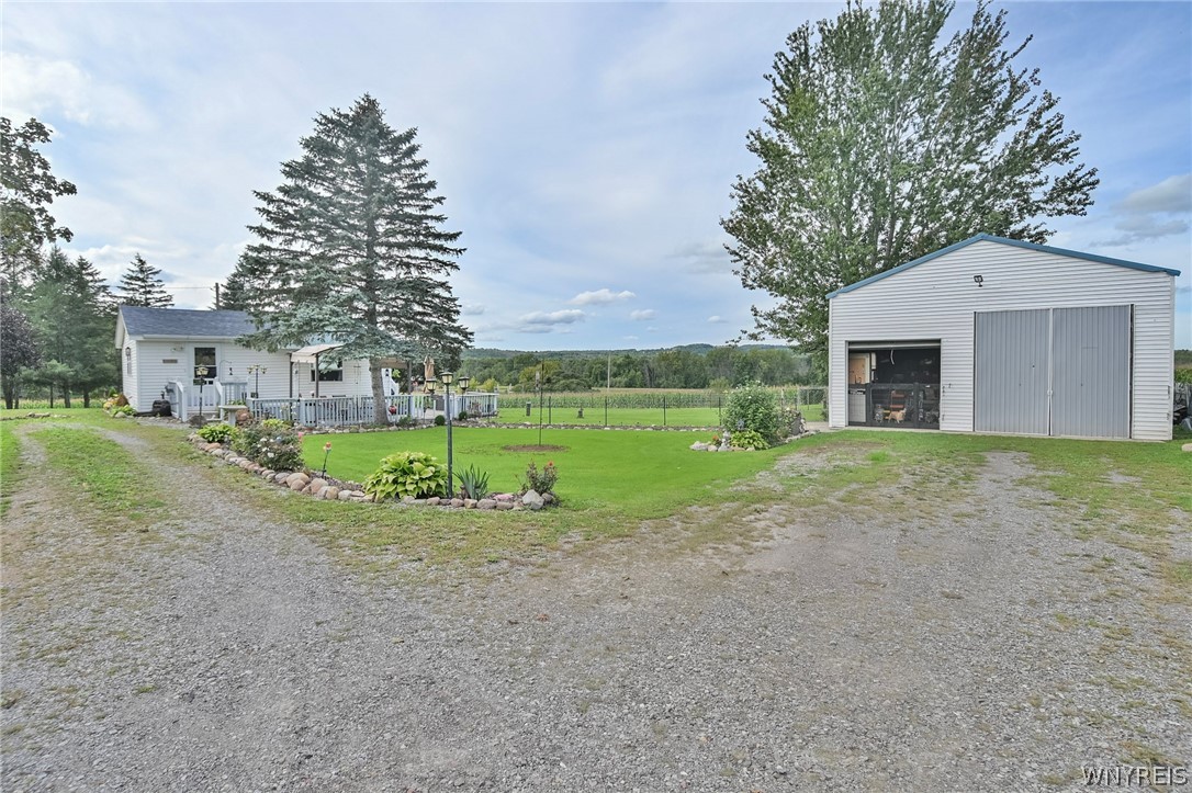 6335 Lemley Road Covington, NY 14591 - Photo 1 of 28 font of house and barn