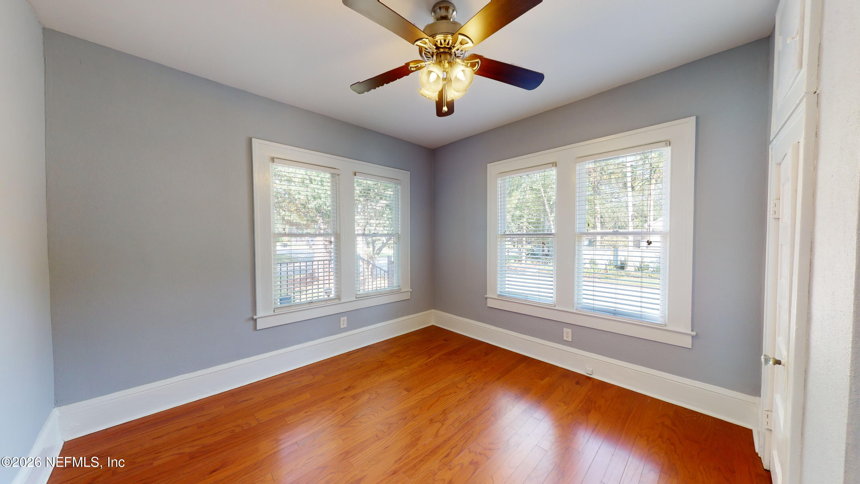 1292 Wolfe Street Jacksonville, FL 32205 - Photo 11 of 27 a view of an empty room with window and chandelier fan