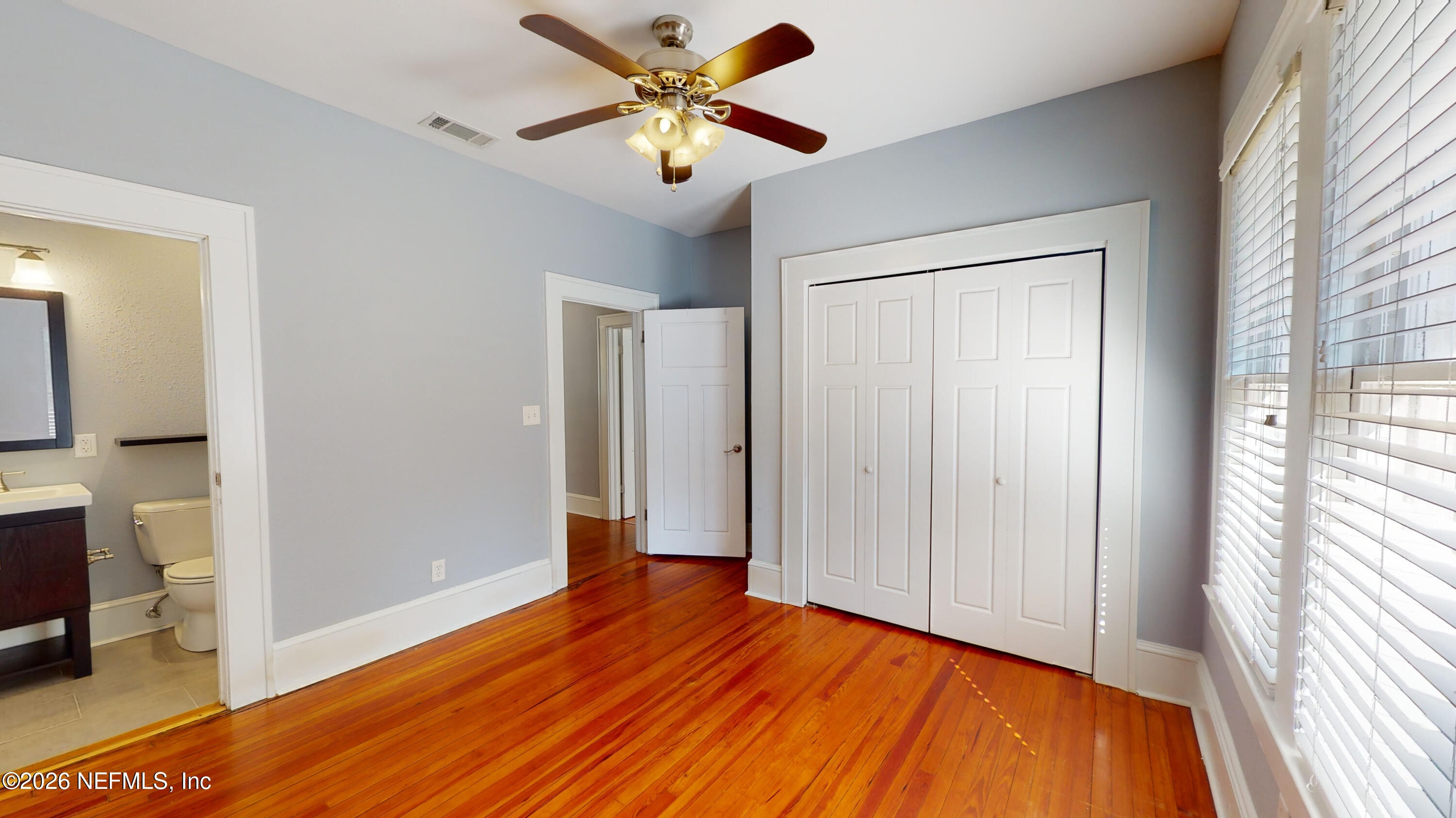 1292 Wolfe Street Jacksonville, FL 32205 - Photo 20 of 27 a view of empty room with wooden floor and fan