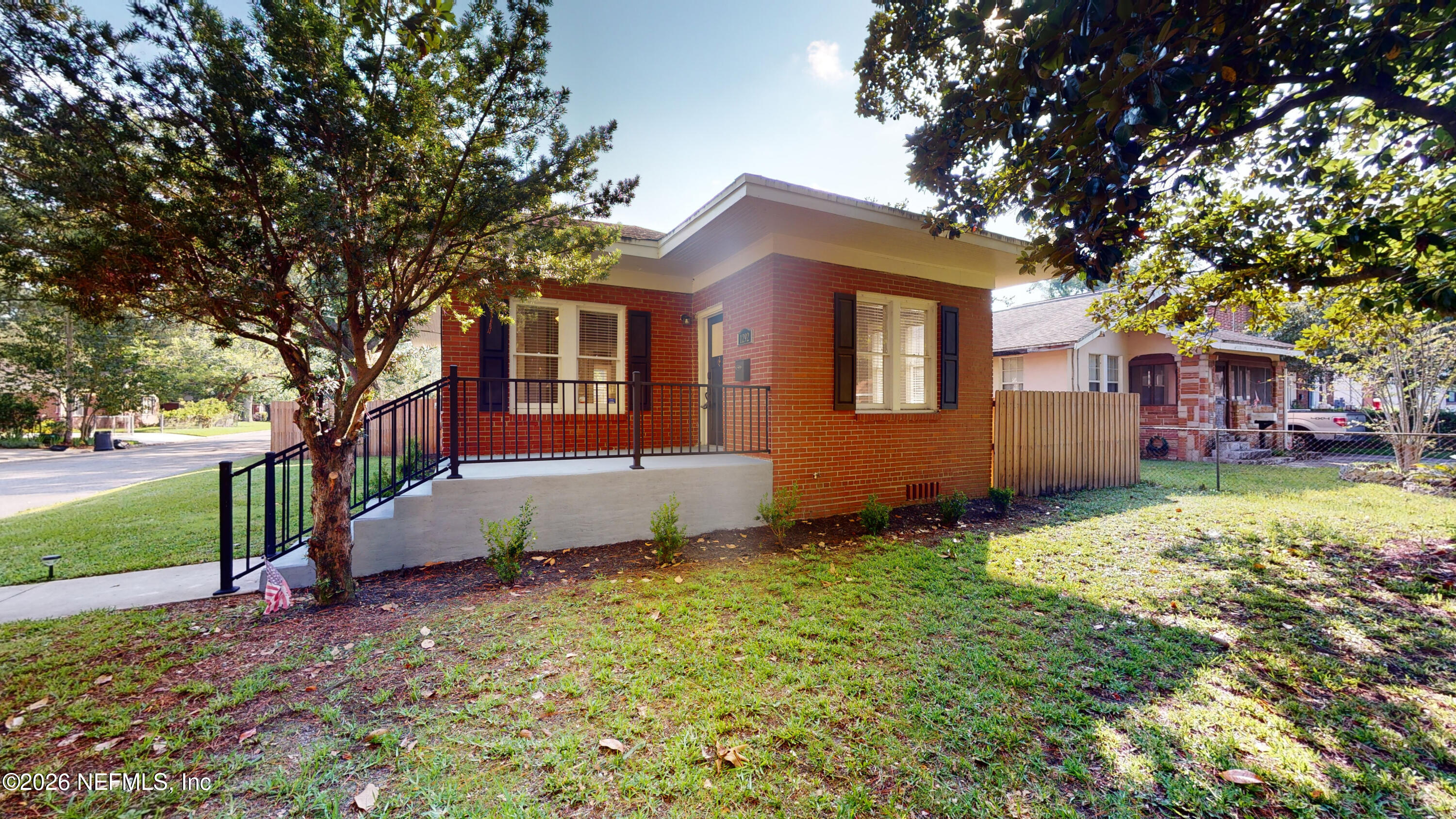 1292 Wolfe Street Jacksonville, FL 32205 - Photo 2 of 27 a front view of a house with a yard