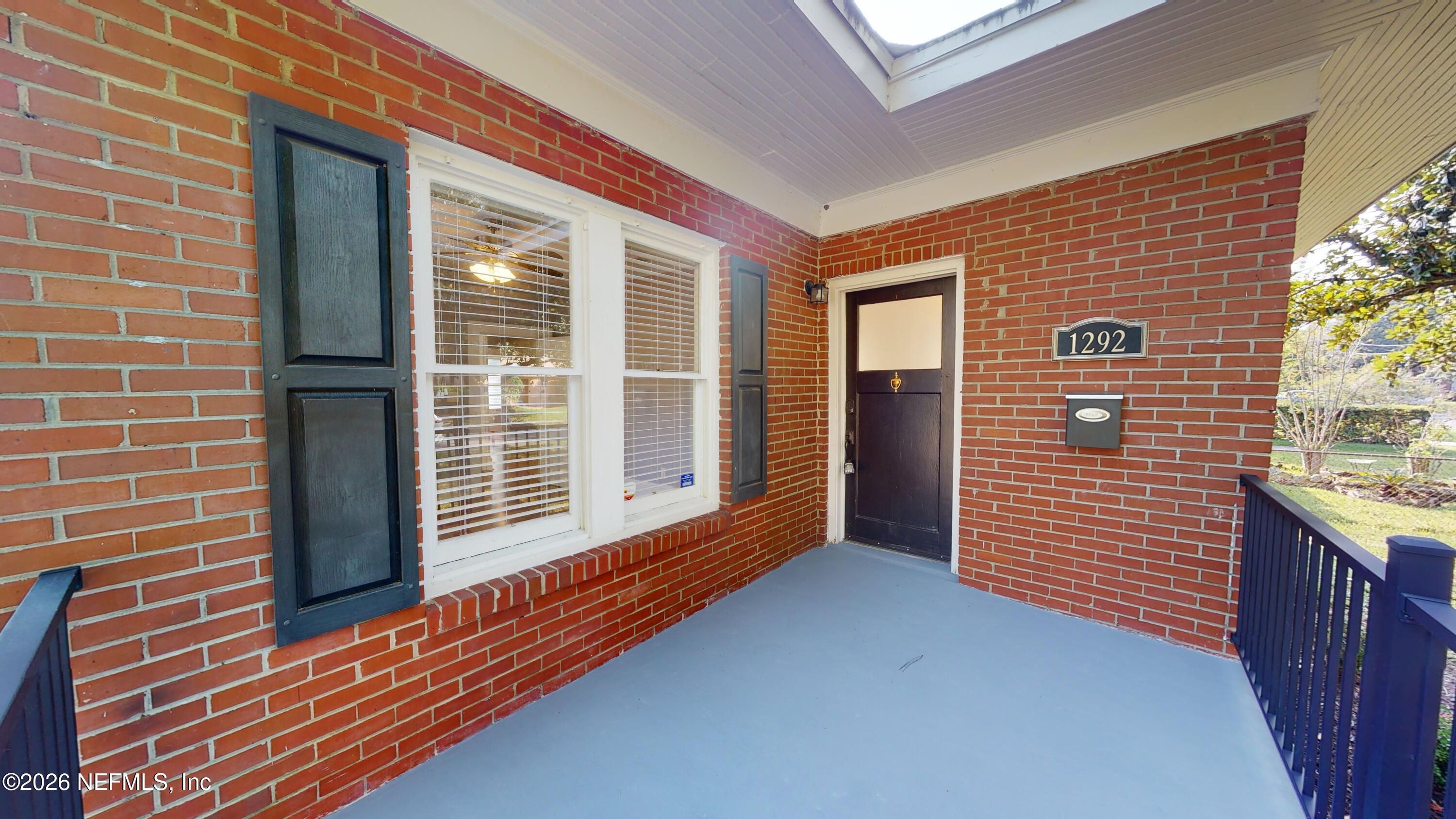 1292 Wolfe Street Jacksonville, FL 32205 - Photo 6 of 27 a view of porch with a door and wooden floor