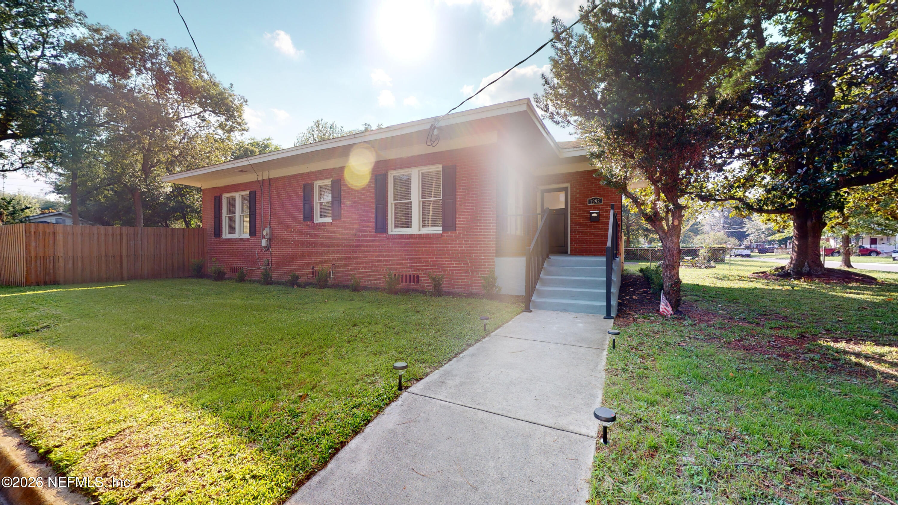 1292 Wolfe Street Jacksonville, FL 32205 - Photo 7 of 27 a front view of a house with garden