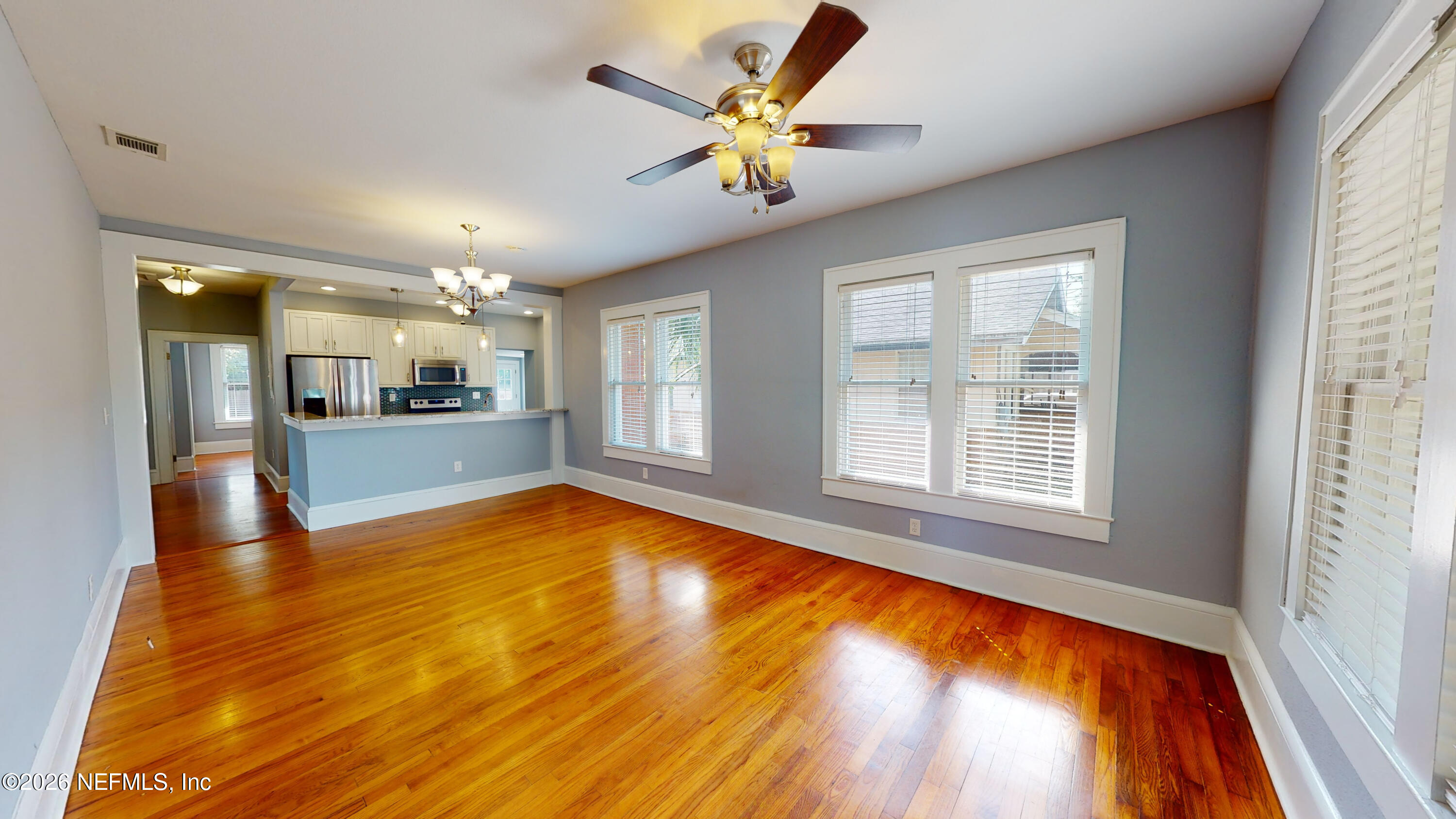 1292 Wolfe Street Jacksonville, FL 32205 - Photo 8 of 27 a view of an empty room with window and wooden floor
