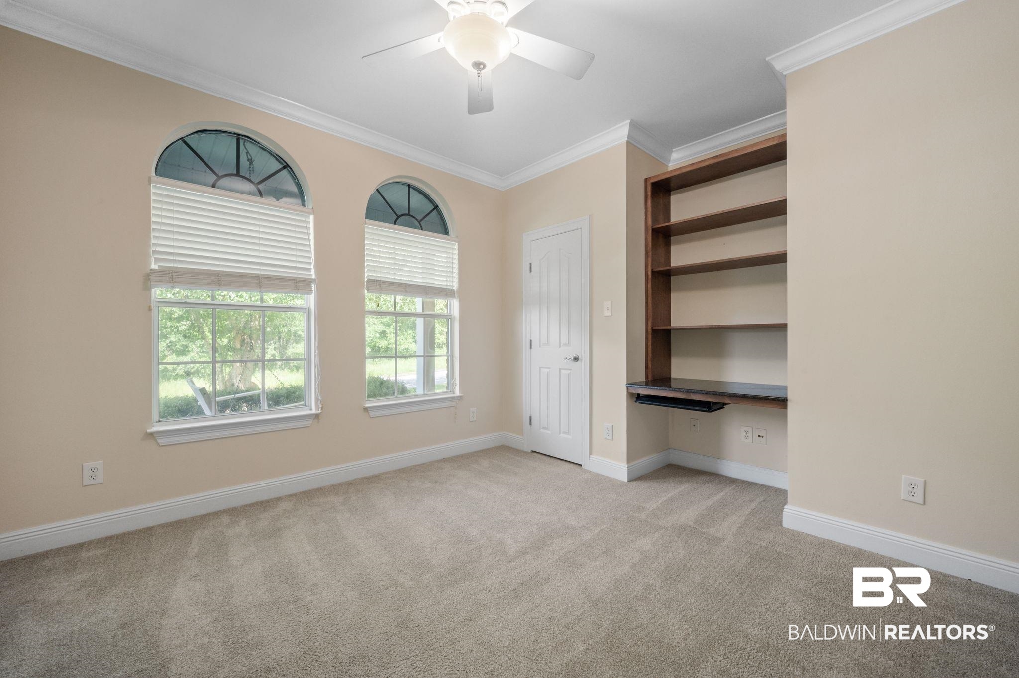 2041 Ridgeline Drive Mobile, AL 36695 - Photo 24 of 43 Unfurnished bedroom featuring ornamental molding, a closet, light colored carpet, and ceiling fan