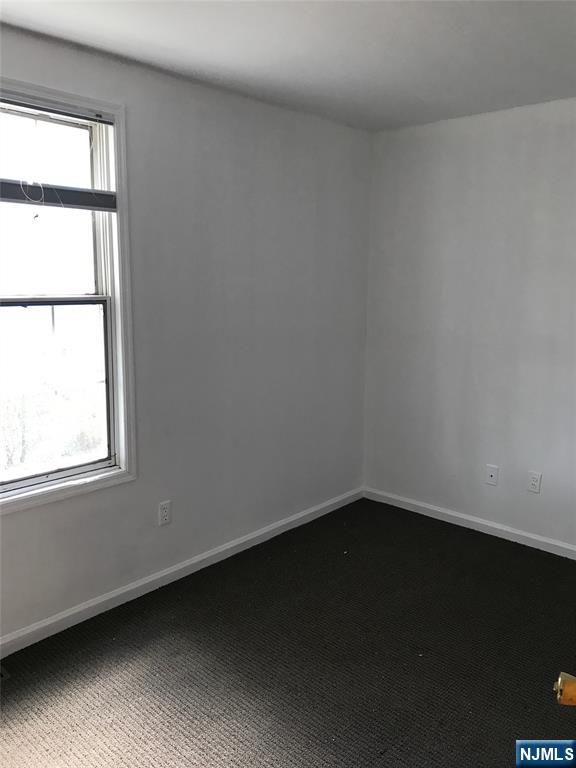 1 Cedar Lane Paramus, NJ 07652 - Photo 9 of 13 an empty room with a window