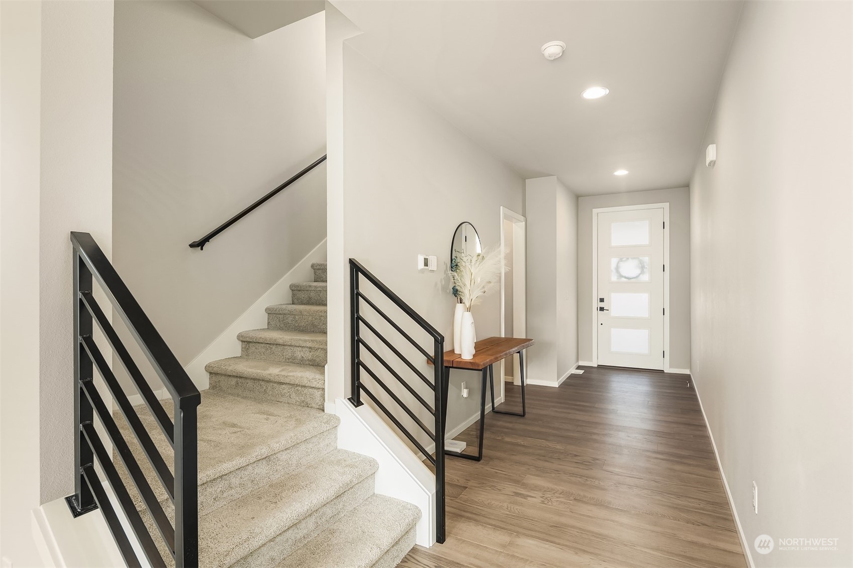 116 180th Place Southwest Bothell, WA 98012 - Photo 3 of 32 a view of an entryway with wooden floor