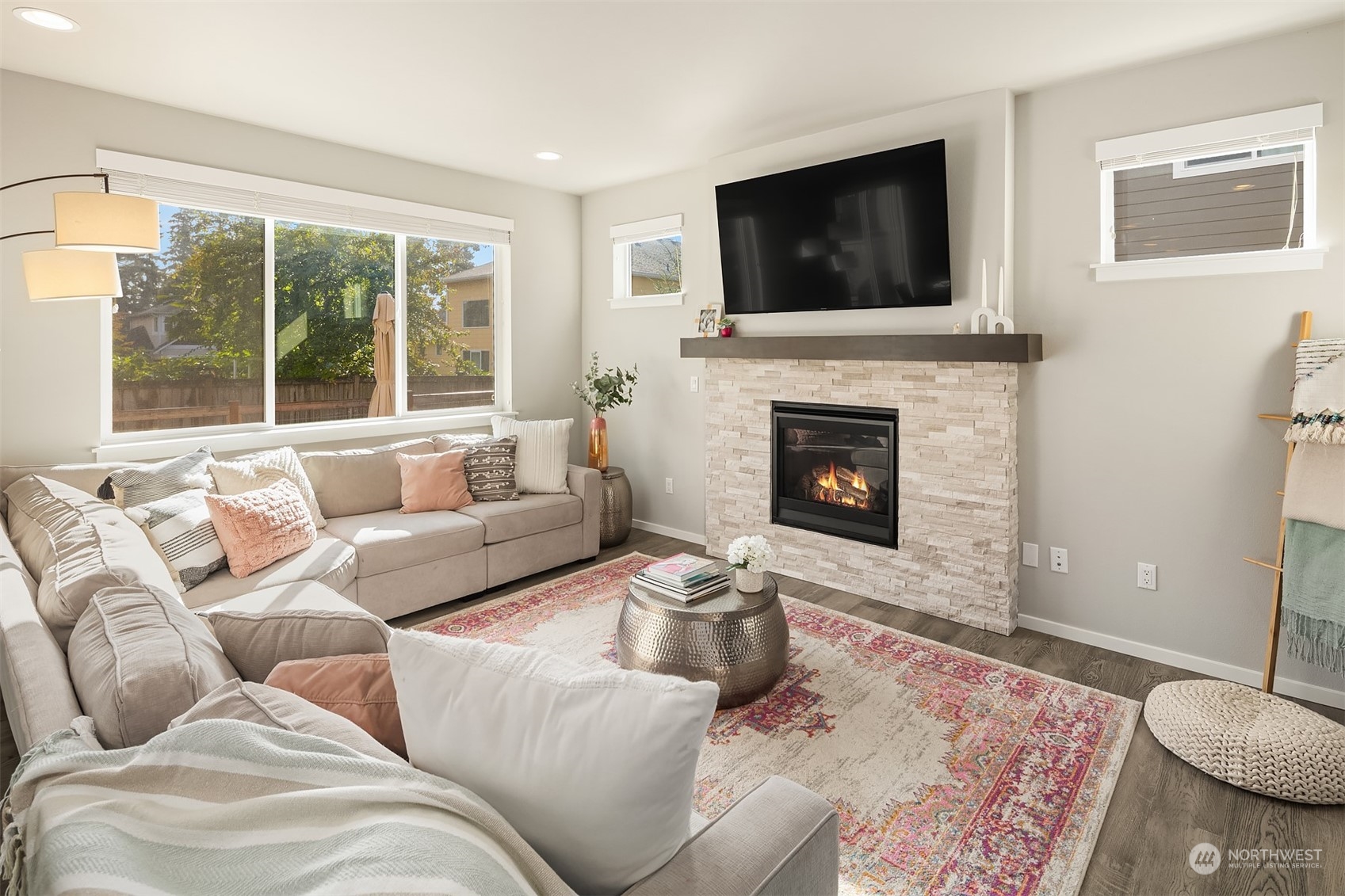 116 180th Place Southwest Bothell, WA 98012 - Photo 5 of 32 a living room with furniture a fireplace and a flat screen tv
