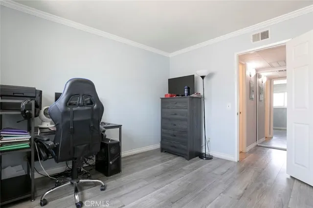 a bedroom with a bed and a table in it