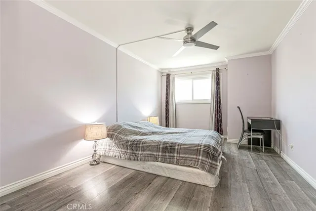 a view of elevator with hallway and wooden floor