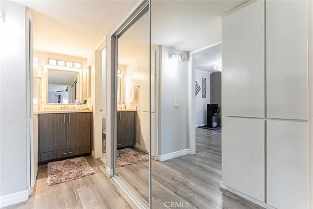 a bathroom with a sink a toilet and shower curtain