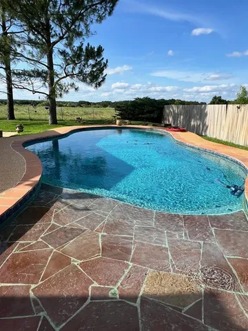 a view of an outdoor space and swimming pool