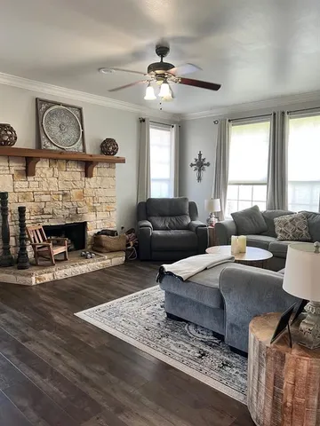 a living room with furniture and a fireplace