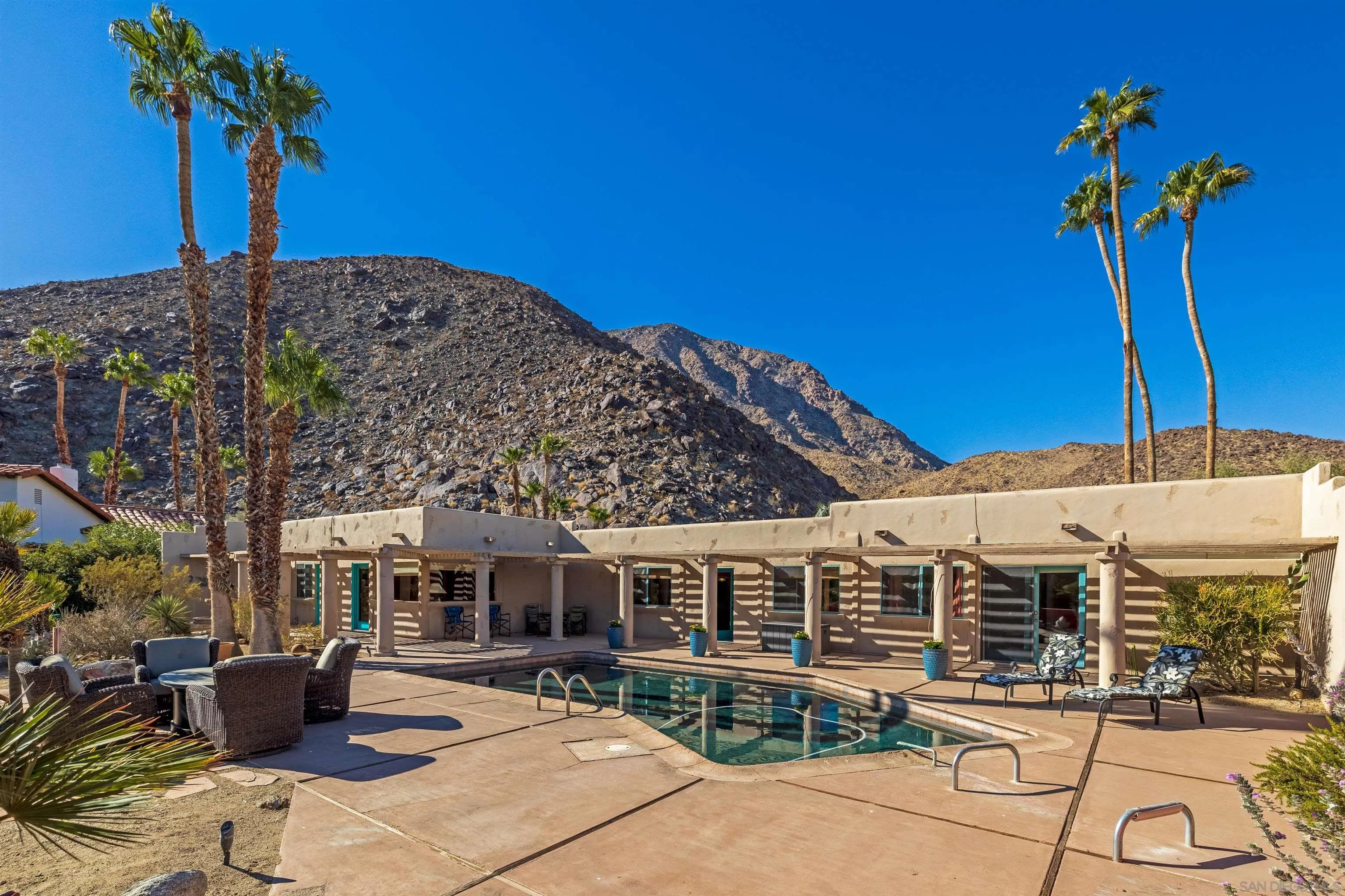119 Montezuma Road Borrego Springs, CA 92004 - Photo 15 of 47 a front view of a building with sitting area