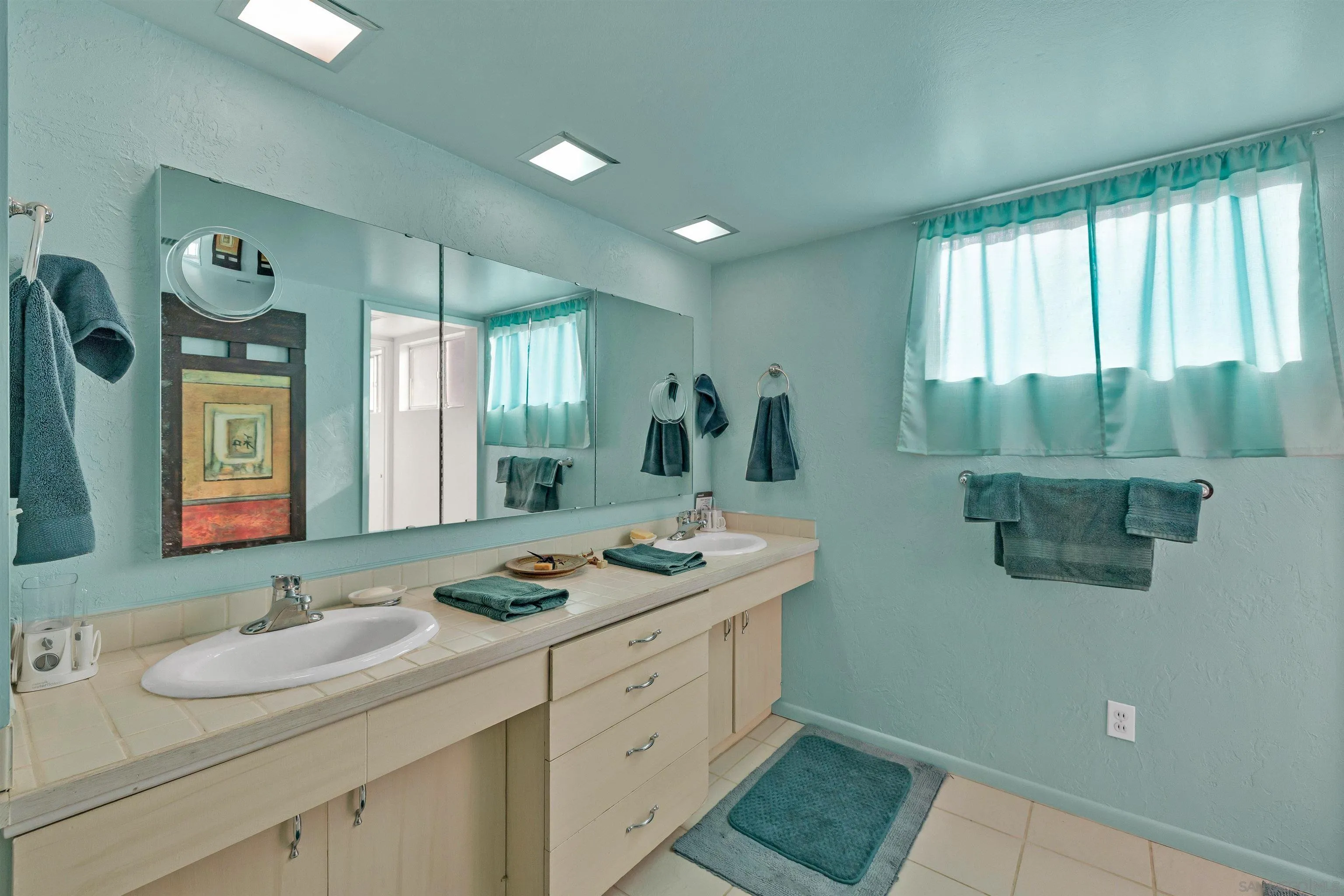 119 Montezuma Road Borrego Springs, CA 92004 - Photo 39 of 47 a bathroom with a granite countertop sink mirror and window