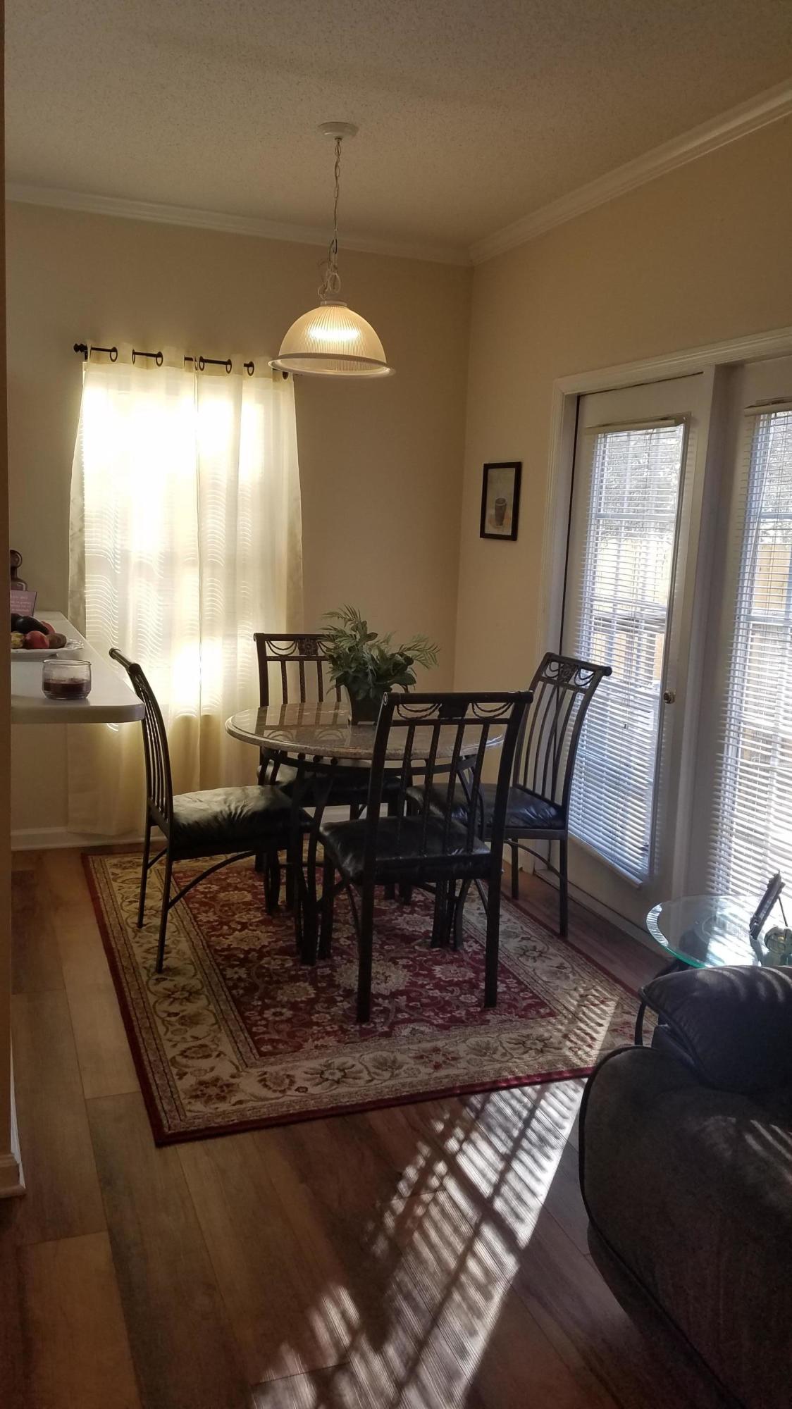 732 East Mack Bayou Drive, Unit 8 Santa Rosa Beach, FL 32459 - Photo 12 of 17 a view of a dining room with furniture window and outside view