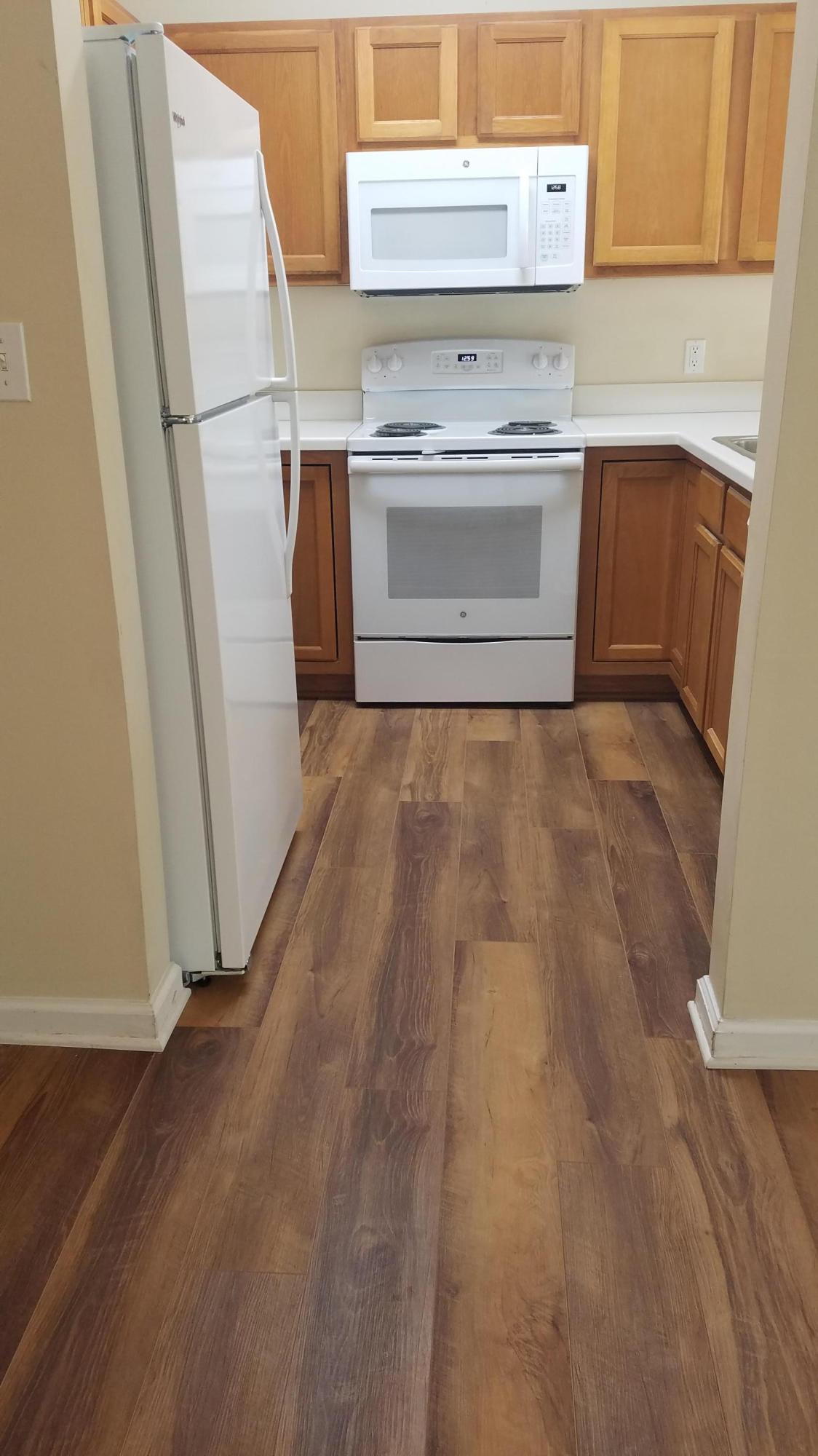 732 East Mack Bayou Drive, Unit 8 Santa Rosa Beach, FL 32459 - Photo 7 of 17 a kitchen with a stove top oven and a refrigerator