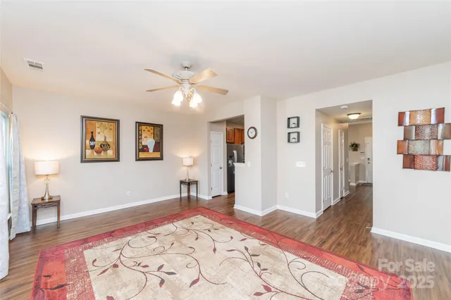 a bedroom with a bed and a wooden floor