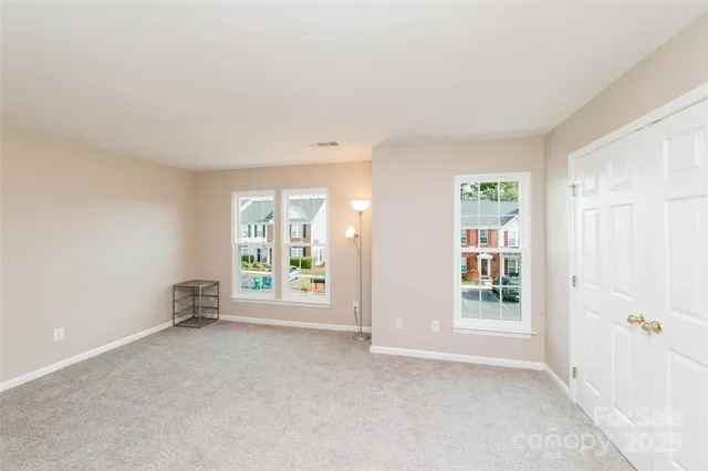 a view of room with furniture and tv