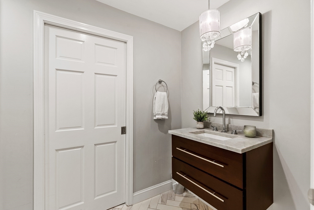 16 Cooke Road Lexington, MA 02420 - Photo 11 of 21 a bathroom with a sink vanity and a mirror