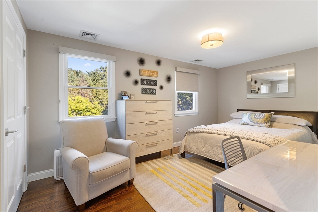 16 Cooke Road Lexington, MA 02420 - Photo 14 of 21 a bedroom with furniture and a large window