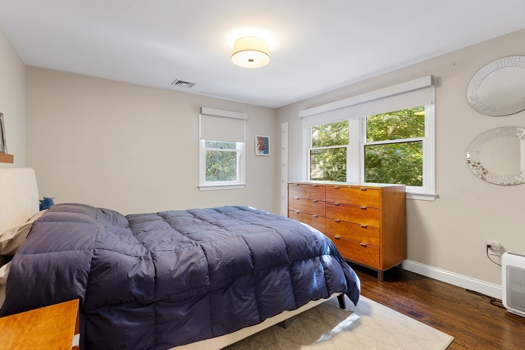 16 Cooke Road Lexington, MA 02420 - Photo 16 of 21 a bedroom with a bed and a window