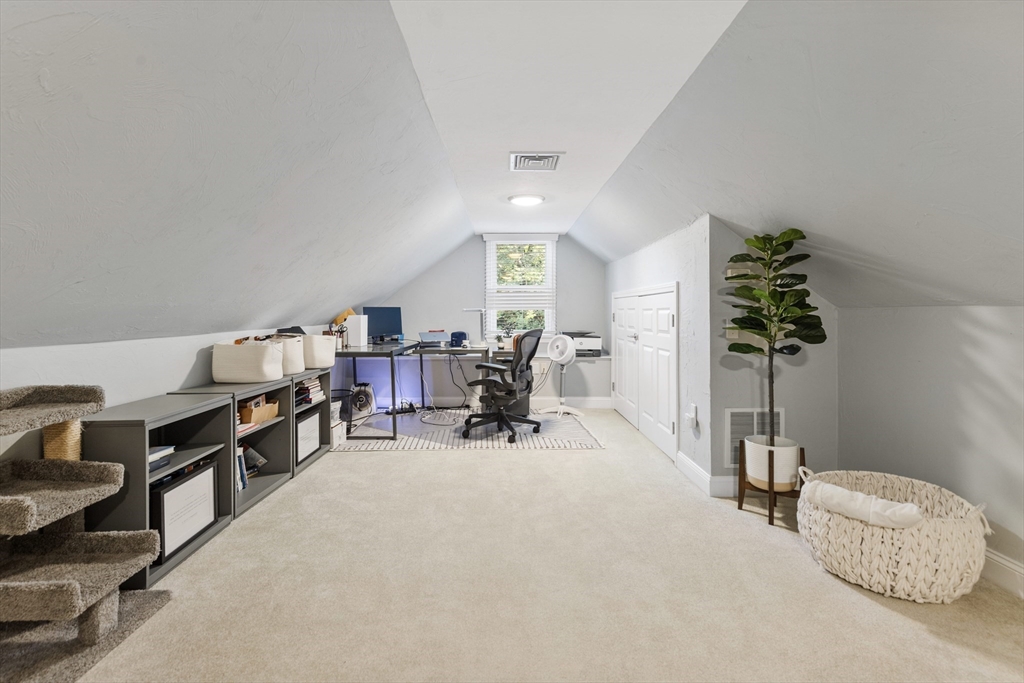 16 Cooke Road Lexington, MA 02420 - Photo 17 of 21 a view of a workspace with furniture and a potted plant