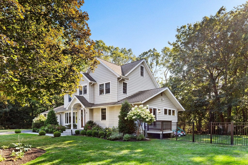 16 Cooke Road Lexington, MA 02420 - Photo 2 of 21 a front view of a house with garden